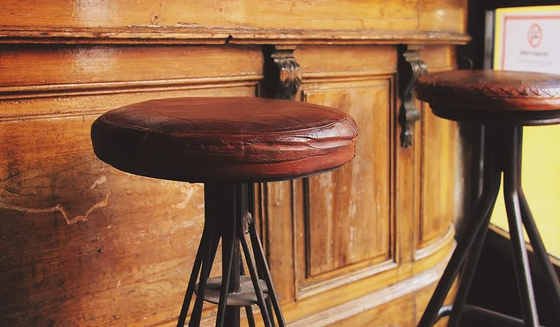 Hairpin leg stools in a café and bar setting