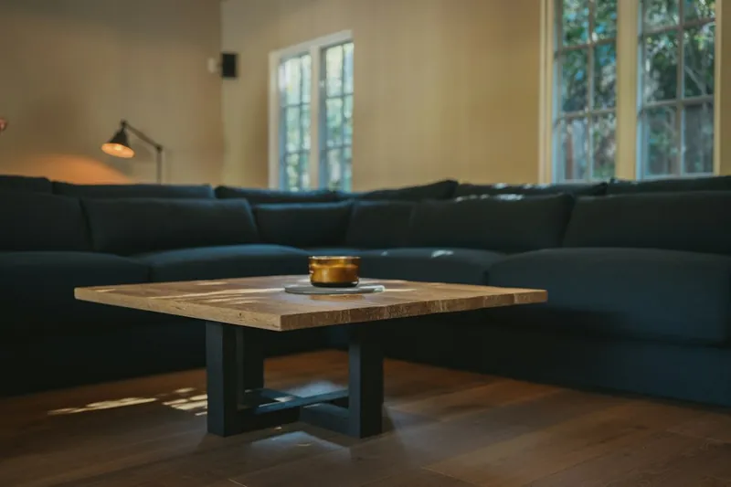 Resin river coffee table in reclaimed wood with a clear epoxy river