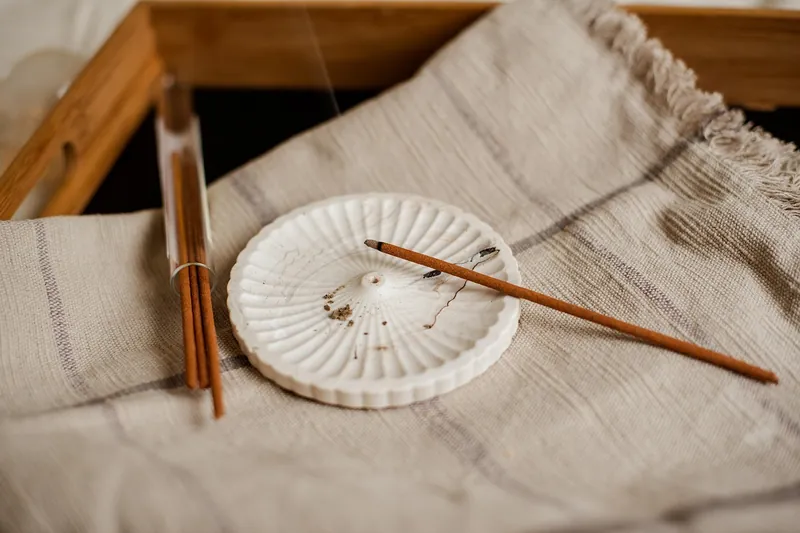 Handcrafted incense holders made in India — brass burners, carved-wood ash-catchers and marble bases