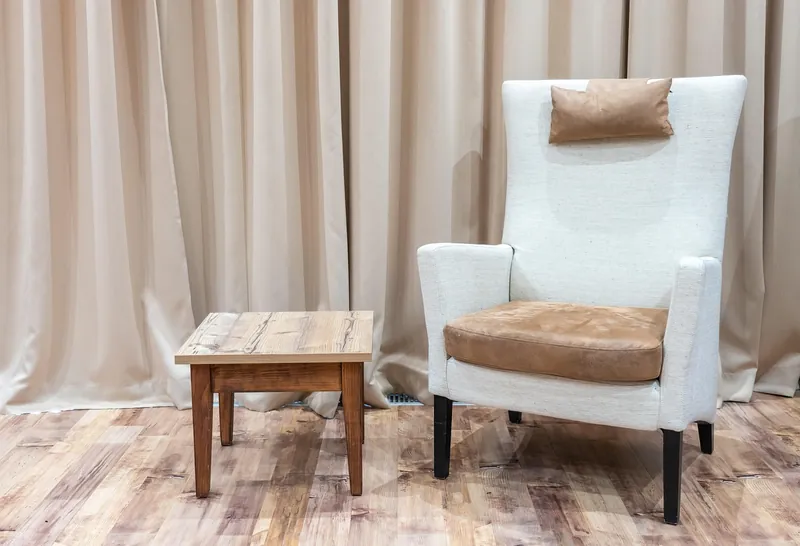 Hand-woven cane armchair on a solid-wood frame, made in Jodhpur, India