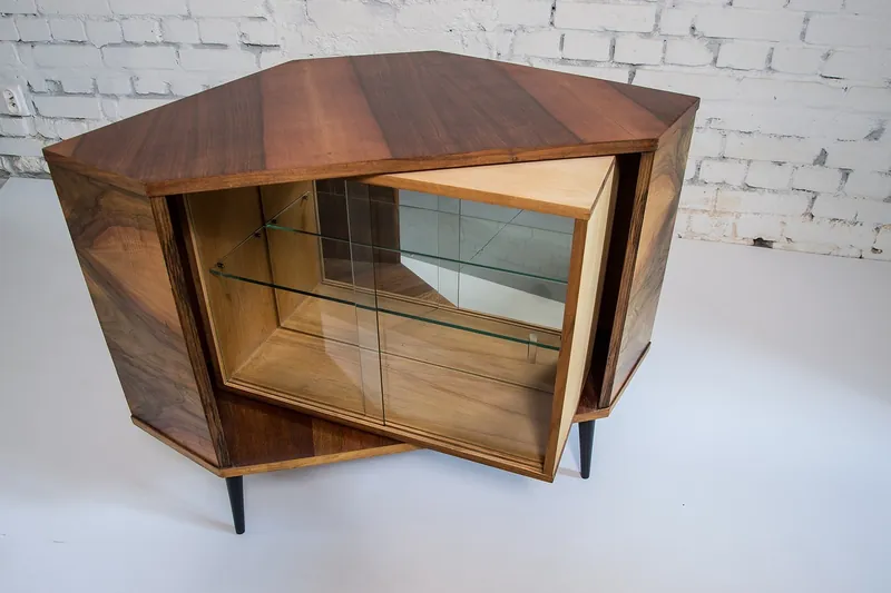 Mid-century modern bar cabinet with tapered wood legs and brass pulls handcrafted in Jodhpur, India