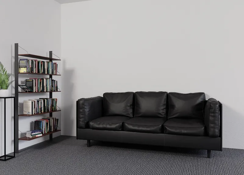 Cane bookshelf with hand-woven rattan side panels on a natural solid-wood frame, handcrafted in Jodhpur, India