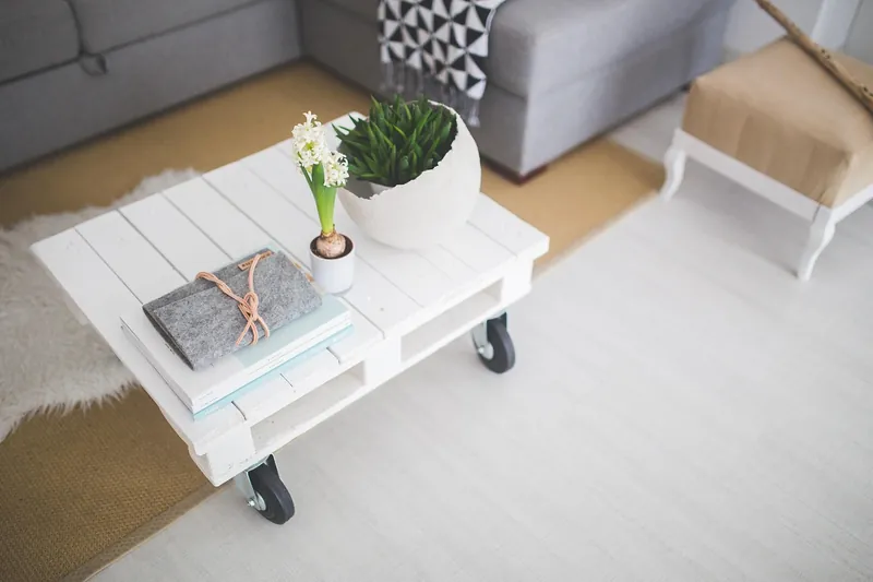 Hairpin leg coffee table with a solid-wood top on slim powder-coated black steel legs, handcrafted in Jodhpur, India