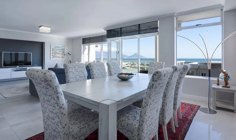 Solid-wood and upholstered dining chairs handcrafted in Jodhpur, India