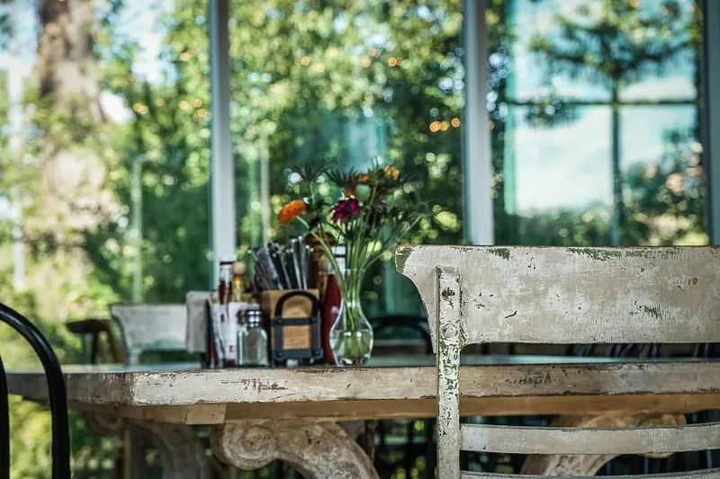 Solid rubberwood dining table with a pale, close-grained stained top, handcrafted in Jodhpur, India