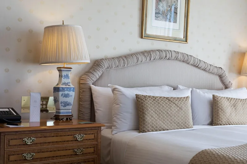 Solid sheesham farmhouse headboard with horizontal plank detail and natural wax finish
