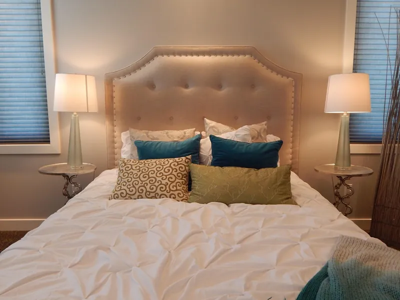 Scandinavian headboard in light-toned solid wood with a clean minimal profile and tapered legs, handcrafted in Jodhpur, India