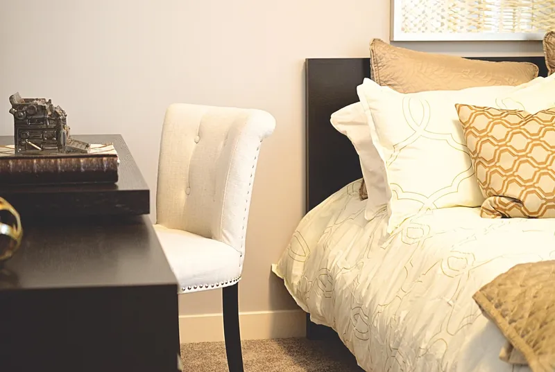 Scrolled wrought iron headboard with filigree detail