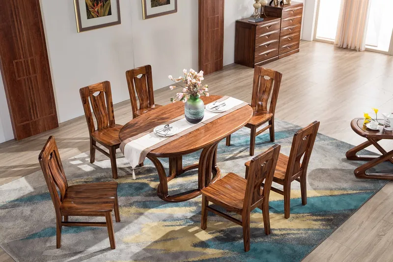 Scandinavian dining table with a pale live-edge solid-wood slab top on slim tapered legs, made in India